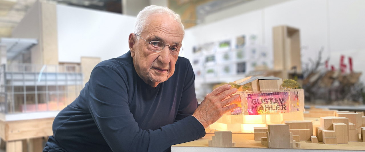 Frank Gehry with concert hall model